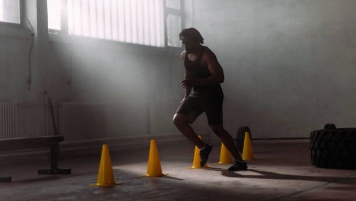 Person performing workout ladder exercises for fat loss and endurance.